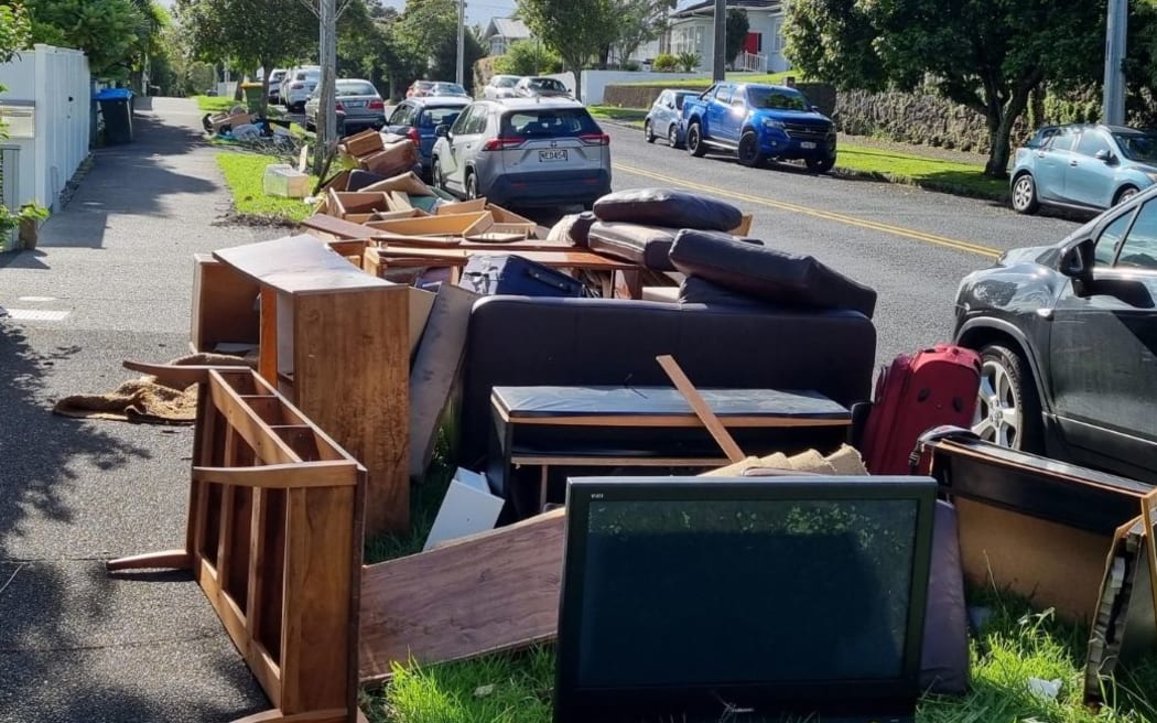 Auckland flooding - piles of rubbish on Shackleton Road in Mt Eden