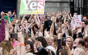 'Yes' campaigners celebrate the official result of the Irish abortion referendum at Dublin Castle in Dublin on May 26, 2018 which showed a landslide decision in favour of repealing the constitutional ban on abortions.