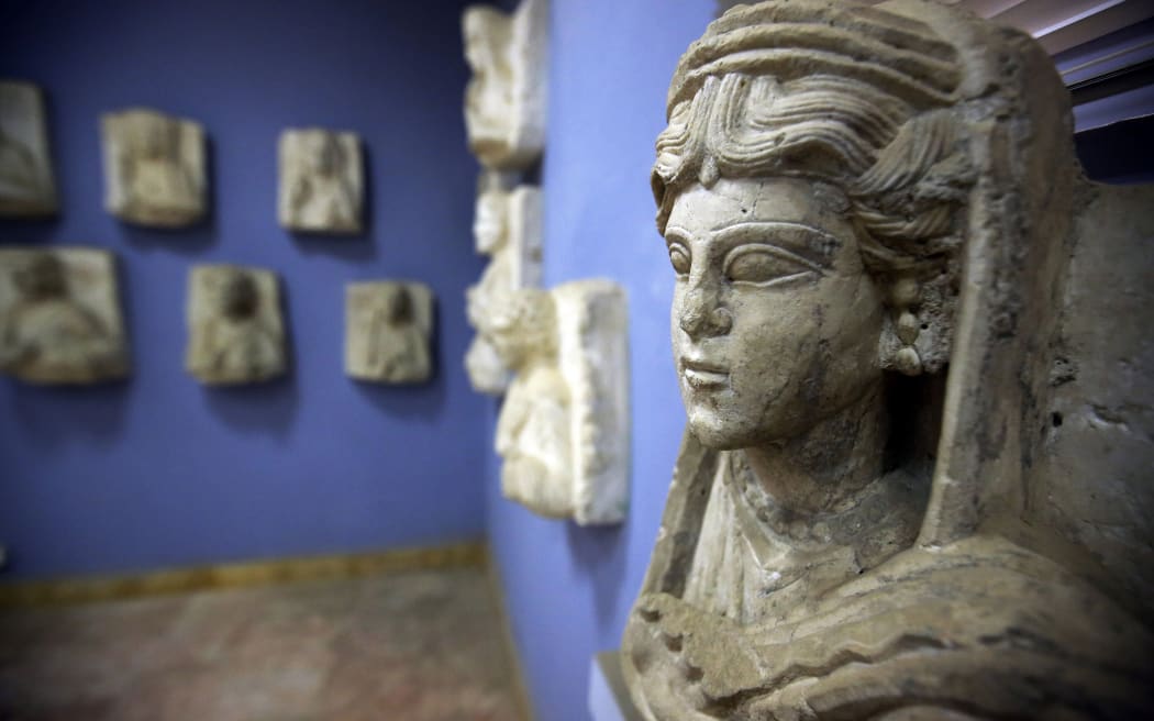 Statues and artifacts at Palmyra's museum. Hundreds of treasures have been moved to Damascus to protect them.