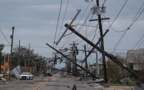 LAKE CHARLES, LOUISIANA - AUGUST 27: A street is seen strewn with debris and downed power lines after Hurricane Laura passed through the area on August 27, 2020 in Lake Charles, Louisiana .