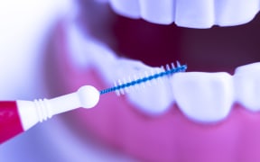 Inter dental teeth cleaning brush healthy floss action between each tooth to remove plaque.