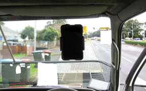 The A4-sized tablet stuck on the windscreen directly in front of the driver.