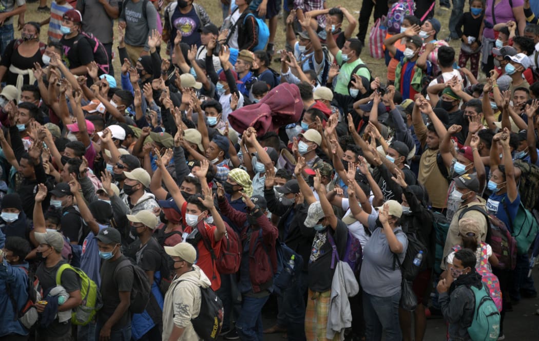 Honduran migrants, part of a caravan heading to the United States, gather to pray in Vado Hondo, Guatemala on January 17, 2021.