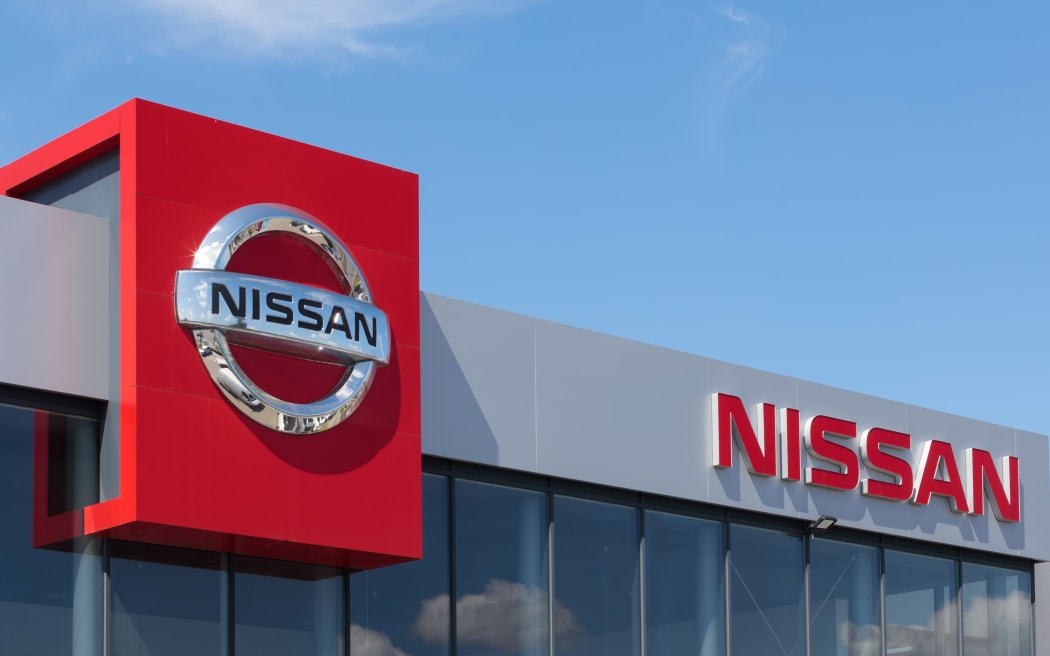 Poland, Przezmierowo - July 27, 2023: The Nissan logo prominently displayed on the wall of a car dealer's building.