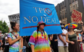 Protesters march down Queen Street