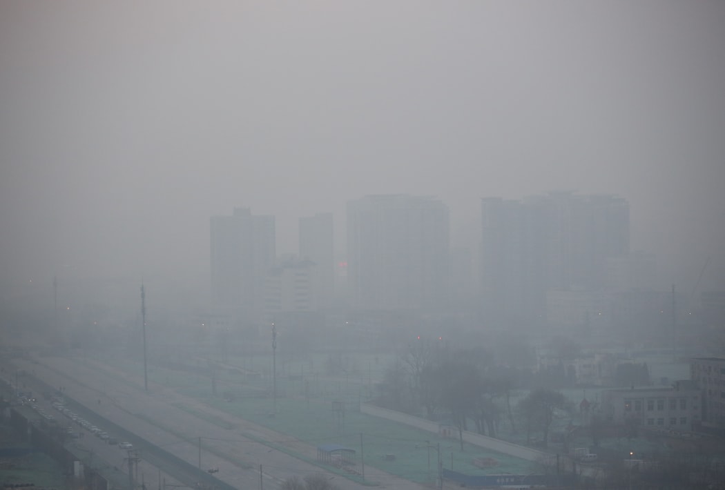 Cities in northeast China were blanketed in thick smog, with the weather bureau issuing orange smog alerts  its second-highest warning  for seven areas in the region.