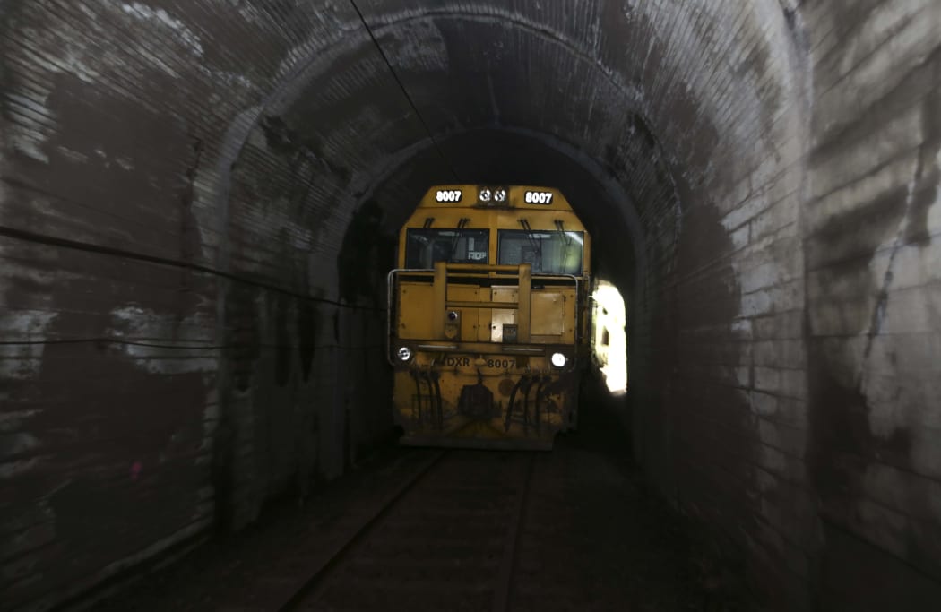 Train stuck between in a tunnel between slips.