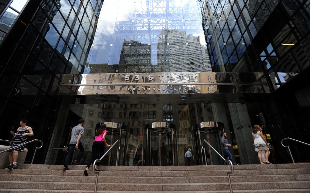 People enter and exit the Boston Globe building, 15 August 2018.