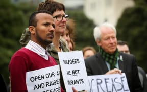 Protesters gather at Parliament for the Government to increase the refugee quota.