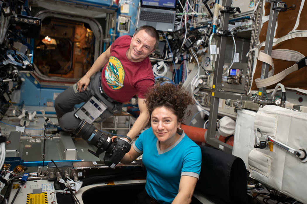 NASA astronauts Andrew Morgan and Jessica Meir photographing earth from the International Space Station, in March.