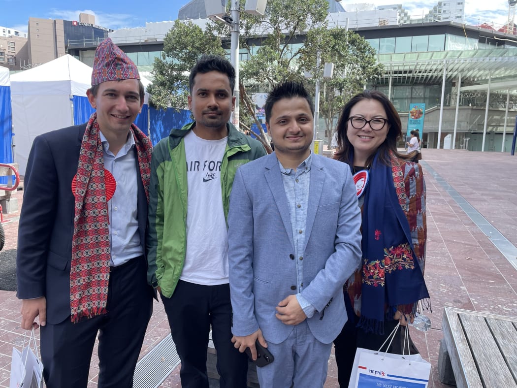 National Party MP Simeon Brown (left) and Melissa Lee (far right) with the members of Nepali community.