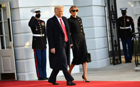 Donald Trump and First Lady Melania make their way to board Marine One, leaving the White House for the final time.