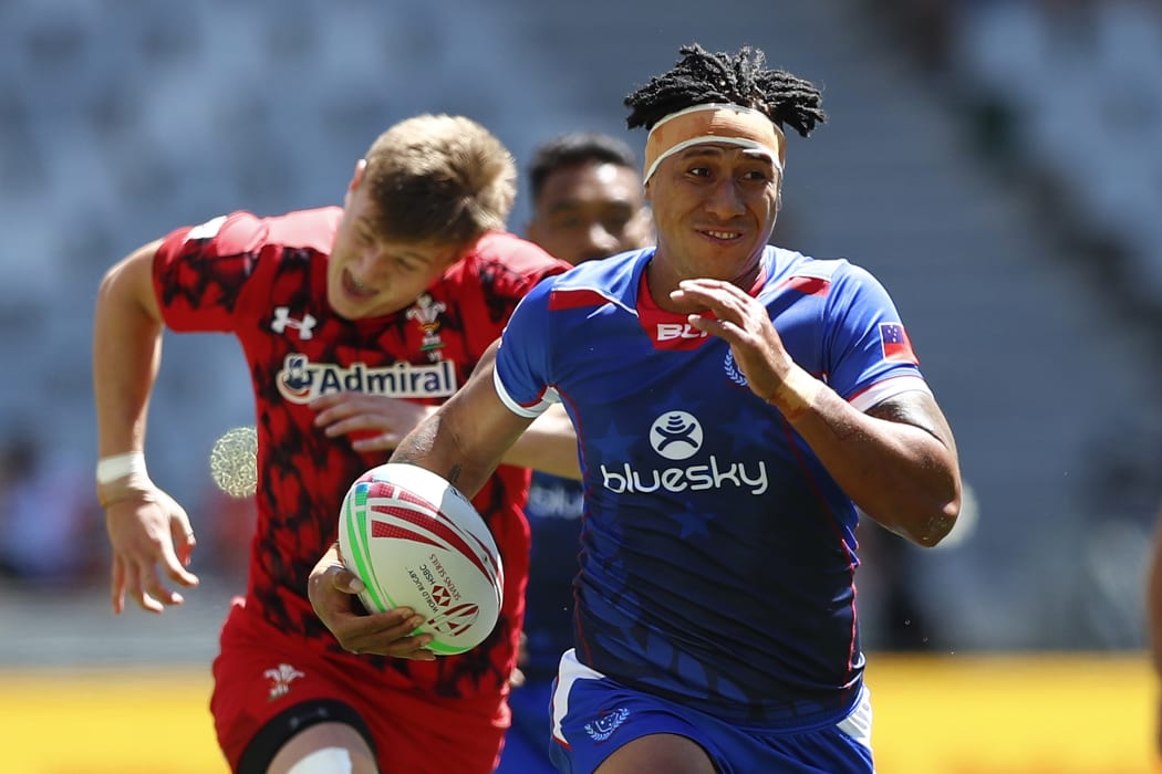 Samoa's Alatasi Tupou races away from the Wales defence.