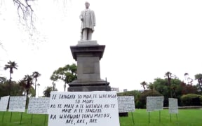 Placards about Parihaka on display in Albert Park.