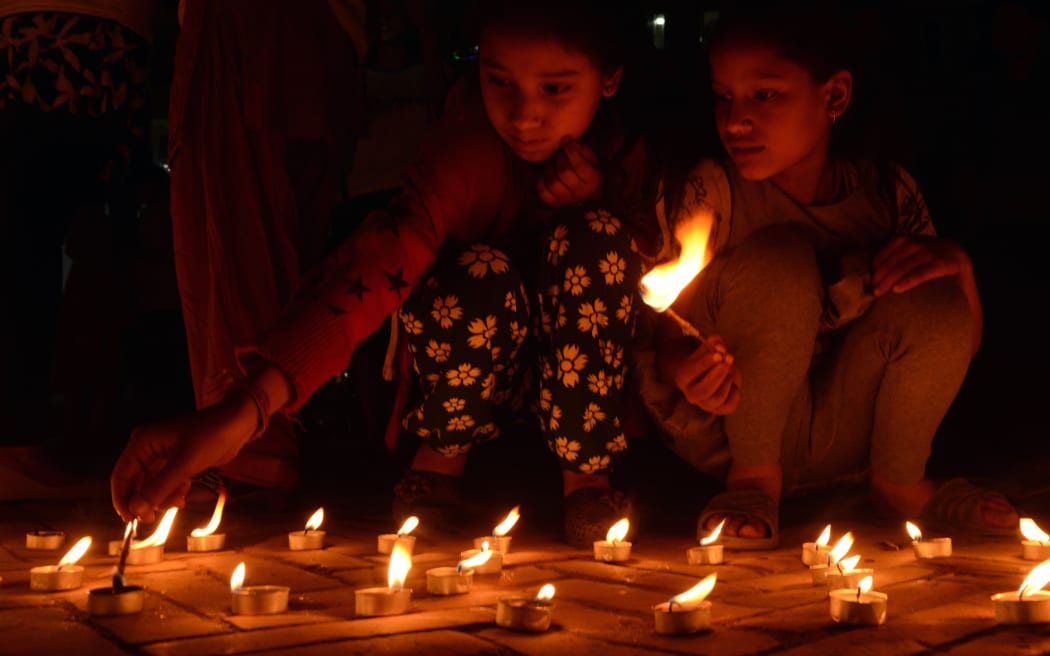 Nepalese residents gather in Durbar Square in Kathmandu to mark the first anniversary of the devastating earthquake.