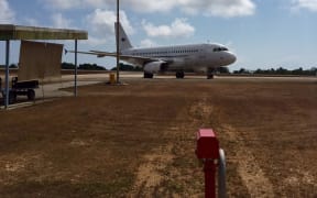 The charter plane on Christmas Island waiting to take the New Zealand detainees home tomorrow.