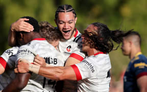 Crusaders players celebrate a try in the pre-season Farmlands Cup match against the Highlanders at Temuka Rugby Club, Temuka, New Zealand. Friday 12 February 2021.