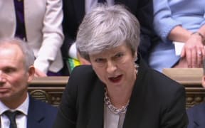 Britain's Prime Minister Theresa May as she speaks during Prime Minister's Questions in the House of Commons in London on February 13, 2019