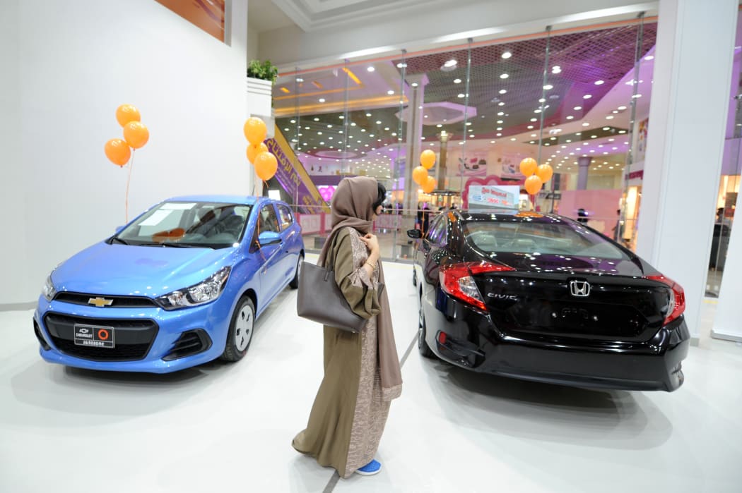 Saudi women tour a car showroom for women.