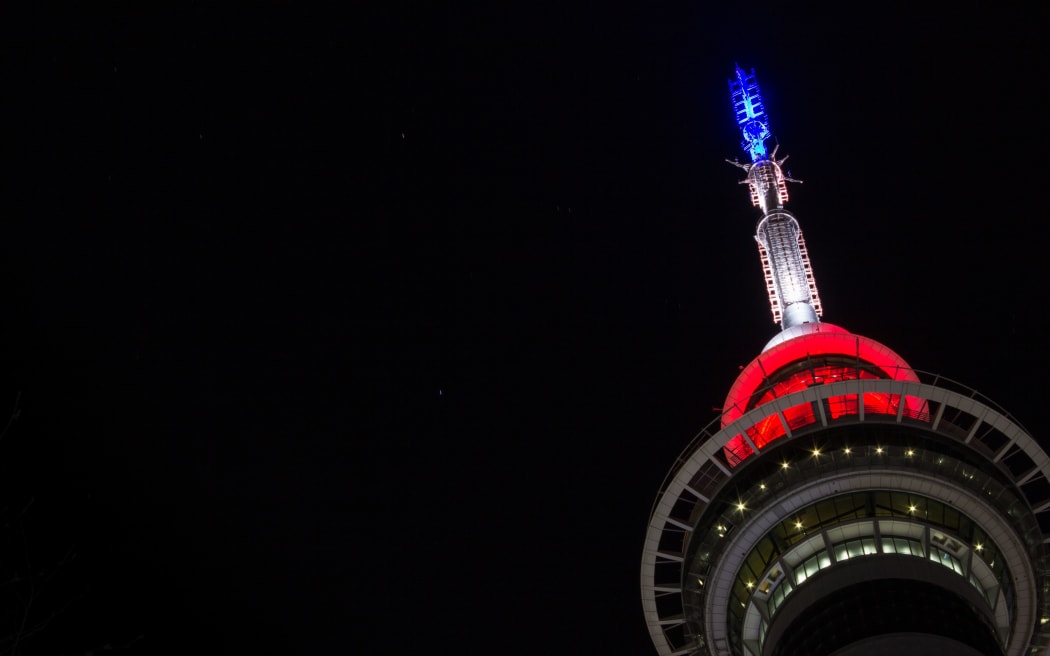Sky Tower lit up in the colours of the French flag in a gesture of support.