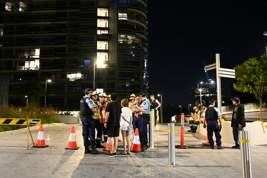 Australian police evacuated thousands of people in west Sydney late Christmas Eve, after residents reported hearing a "loud crack" from a 38-storey building.