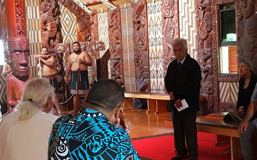 Hugh Rihari speaking in the whare unanga at Waitangi during powhiri for returning taonga including Te Pahi's medal.