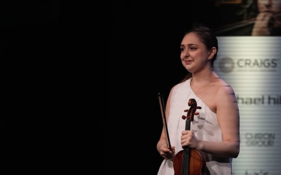 Julia Mirzoev (Canada) playing violin on stage at the 2023 Michael Hill International Violin Competition in Queenstown.