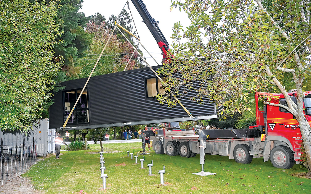 A self-contained home is dropped onto a section at Te Karaka in Tairāwhiti on 6 April. Fifteen of the relocatable pods are being delivered to the region this month for people affected by Cyclone Gabrielle.