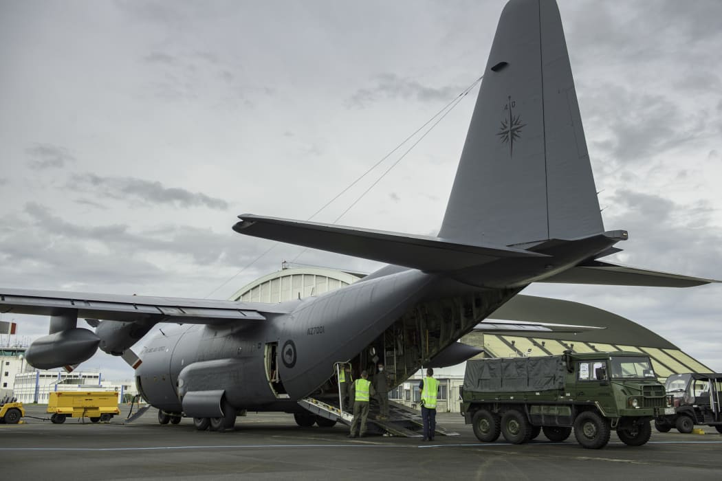 A Royal New Zealand Air Force C-130 Hercules transporting vehicles and other equipment and the Ōhakea base this morning.