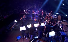 Mark Almond and musicians performing in the BBC Proms David Bowie tribute.
