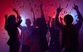 Party people having fun in nightclub
