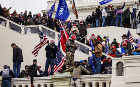 WASHINGTON, DC - JANUARY 06: Pro-Trump supporters storm the U.S. Capitol following a rally with President Donald Trump on January 6, 2021 in Washington, DC.
