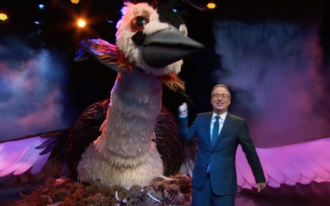 In this screengrab of the Last Week Tonight show, comedian John Oliver appears alongside a giant mechanised grebe as part of his plan to to appeal to hearts and minds in an attempt to stack the Bird of the Century competition.