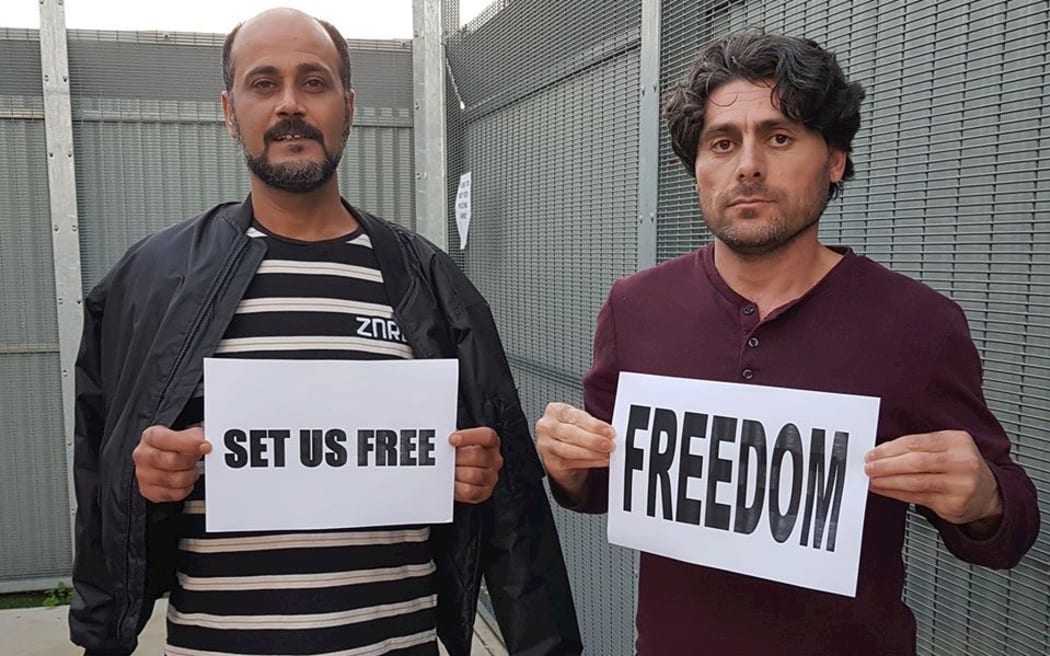 Farhad Bandesh (right) protests in MITA.