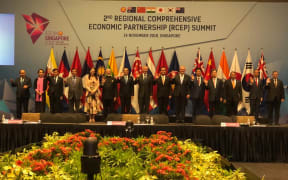 Prime Minister Jacinda Ardern stands with RCEP leaders at the summit in Singapore.