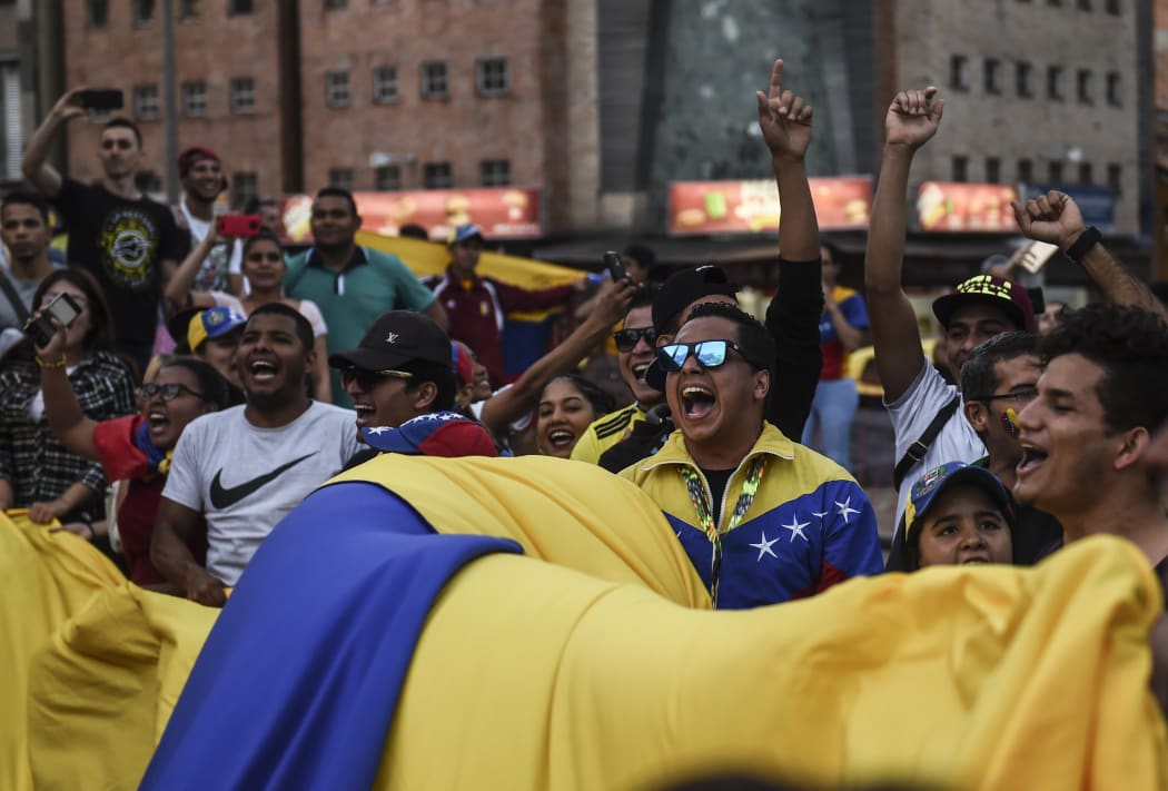 Venezuelans opposed to President Nicolas Maduro hold a demonstration in Medellin, Colombia in support of opposition leader Juan Guaido's self-proclamation as acting president of Venezuela, on January 23, 2019.