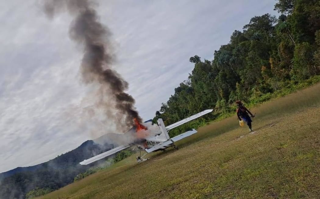 The Susi Air plane that Phillip Mehrtens was piloting being torched by the rebels