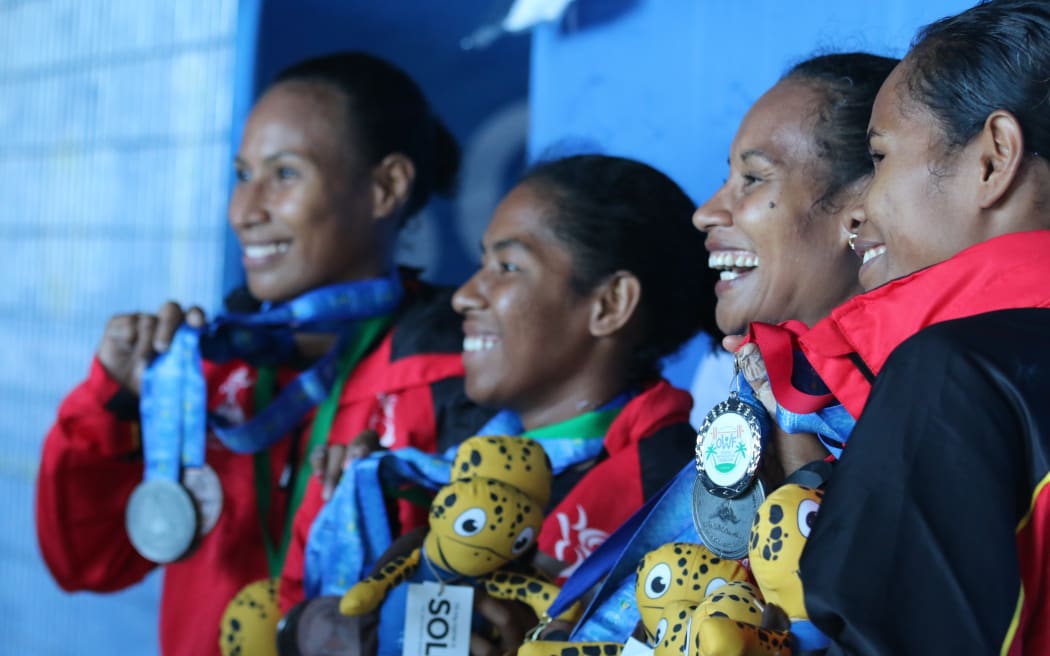 A family affair - Papua New Guinea's Dika Toua (second from right) celebrates with her sisters after qualifying for her sixth Olympic Games.