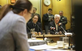 RNZ chief executive Paul Thompson (left) and chair Richard Griffin are grilled at the select committee hearing by National MP Melissa Lee.