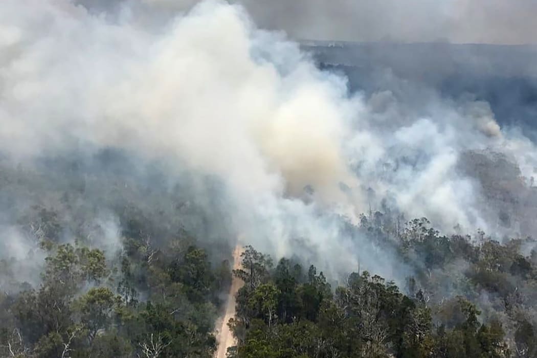 An aerial view of bushfires on Fraser Island, off Australia's east coast on November 29, 2020.