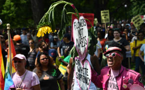 Demonstrators opposed to a far-right rally gather at Lafayette Park opposite the White House.