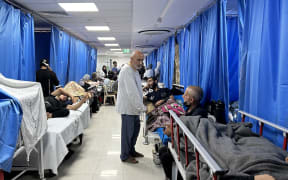 Patients and internally displaced people are pictured at Al-Shifa hospital in Gaza City on November 10, 2023, amid ongoing battles between Israel and the Palestinian Hamas movement. Heavy fighting was raging near Al-Shifa hospital, with Israel saying it had killed dozens of militants and destroyed tunnels that are key to Hamas's capacity to fight. Israel launched an offensive in Gaza after Hamas fighters poured across the heavily militarised border on October 7, killing 1,400 people, mostly civilians, and taking around 240 hostages. (Photo by Khader Al Zanoun / AFP)