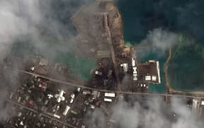 Volcanic ash covering the main port facilities in Nuku'alofa, the capital of Tonga, on 18 January, 2022.