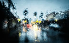 Wet weather from inside a car in traffic