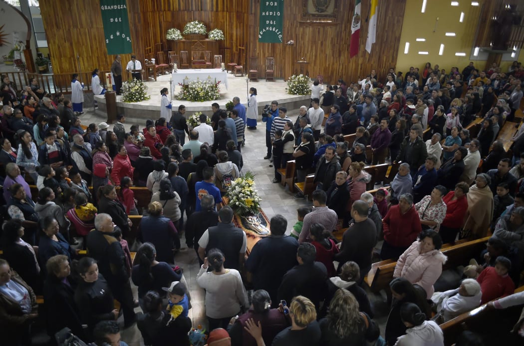 Relatives of three of the people killed in a massive blaze triggered by a leaky pipeline in Tlahuelilpan, attend their funeral in Teltipan de Juarez community, in Hidalgo state, Mexico on January 20, 2019.