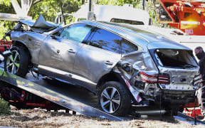 A tow truck recovers the vehicle driven by golfer Tiger Woods in Rancho Palos Verdes, California.