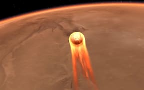 This artist's impression obtained from NASA shows  InSight's entry, descent and landing at Mars