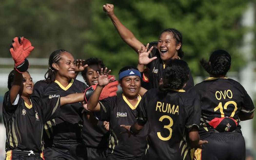 The PNG Lewas celebrate a wicket.
