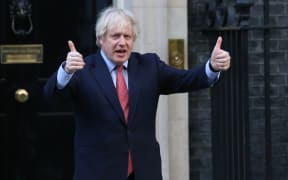 LONDON, UNITED KINGDOM - MAY 28: British Prime Minister Boris Johnson gives thumbs up outside 10 Downing Street in London, United Kingdom on May 28, 2020, as part of the national "clap for carers" to show thanks for the work of Britain's National Health Service (NHS) workers
