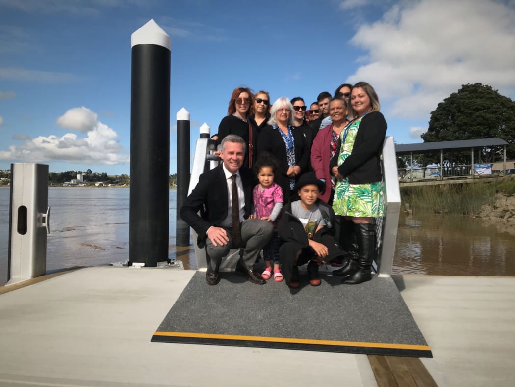 About 50 people gathered for a blessing of the new Dargaville pontoon. At front (from left) Kaipara Mayor Dr Jason Smith with youngsters Riria Hokai (in pink) Lawry Toko (black hat) and Natalie Dyer, KDC Kaipara Kickstart project coordinator.